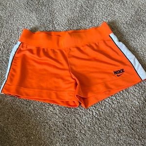 Nike Retro shorts. Size M. Orange with white and black strip down the side